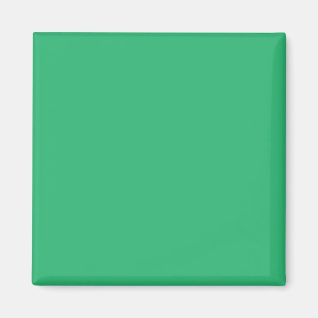 a green background with a white border magnet (Front)