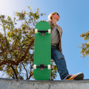 a green background with a white border skateboard