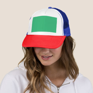 a green background with a white border trucker hat