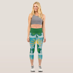 a green shamrock and a yellow sun capri leggings