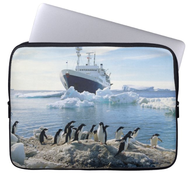 A Group Of Penguins Standing On An Icy Beach Laptop Sleeve (Front)