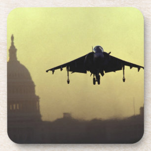 A Harrier jet landing on the Mall at dawn with Coaster