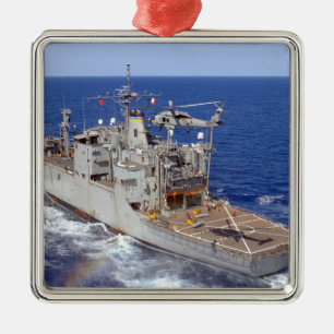 A helicopter clears the flight deck metal tree decoration