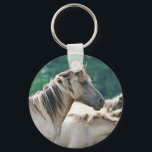 A herd of Brumby Horses from Australia Key Ring<br><div class="desc">A photo of a herd of wild brumby horses from Australia. Light brown buckskin colour,  with long wild manes. Green foliage background.</div>