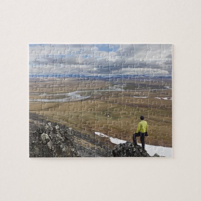 A hiker looks over the Nigu and Etivlik Rivers Jigsaw Puzzle (Horizontal)