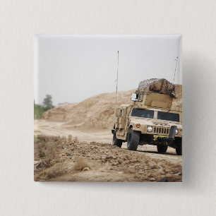 A Humvee conducts security 15 Cm Square Badge