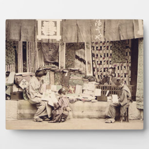 A Japanese cloth store, c.1890 (hand coloured phot Plaque