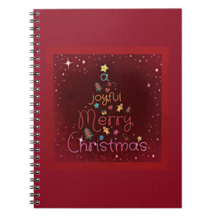 A Joyful Merry Christmas Greeting on Red Spiral Notebook