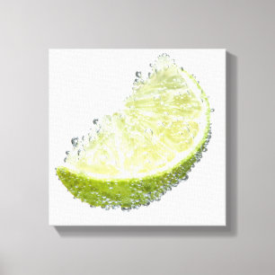 A juicy ripe organic lime wedge fruit submerged canvas print