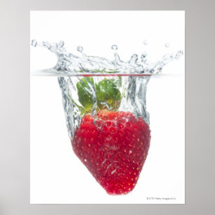 A juicy ripe organic Strawberry fruit splashing Poster