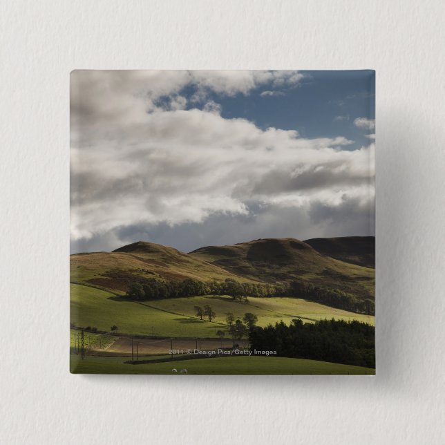 A Landscape With Rolling Hills And Clouds Overhead 15 Cm Square Badge (Front)
