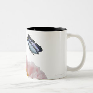 a large pink peony is visited by a ethereal Two-Tone coffee mug