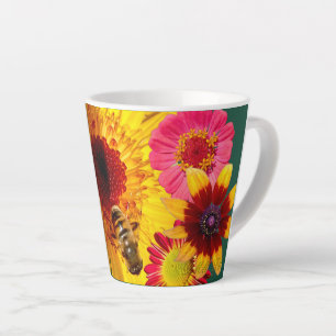 A latte cup of colourful flower and bee fun. 