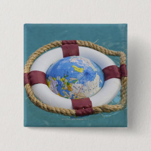 A life preserver and world globe floating 15 cm square badge