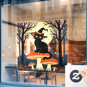 A Little Black Witchy Cat Sitting On A Toadstool