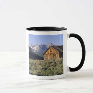 A log cabin and the Sawtooth Mountains in Mug