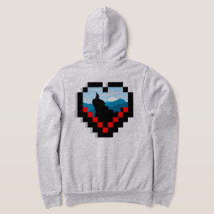 A lone figure sitting on a mountain peak at sunris hoodie