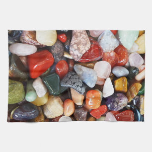 a lot of beautifully coloured stones tea towel
