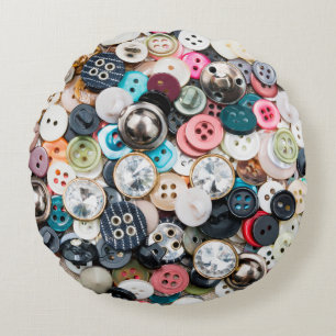 A lot of colorful sewing buttons of different colo round cushion