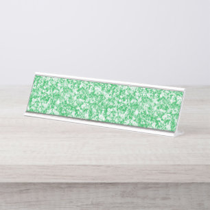 A lush, green fern with delicate, arching fronds f desk name plate
