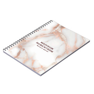 A luxurious rose-gold marble background notebook