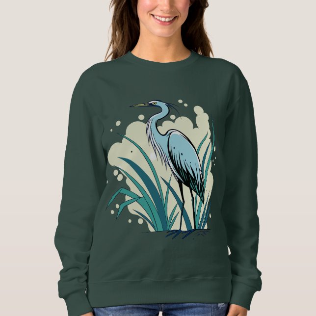 A Majestic Blue Heron Stands Tall In A Vibrant Nat Sweatshirt (Front)
