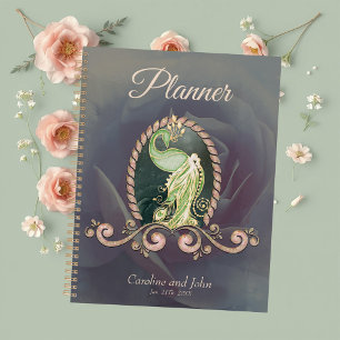 A majestic peacock in gold and green planner