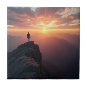 A majestic sunrise seen from the mountain peak tile