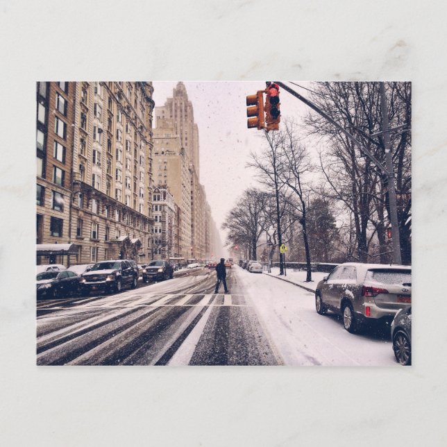 A Man Crossing A Snowy Central Park West Postcard (Front)