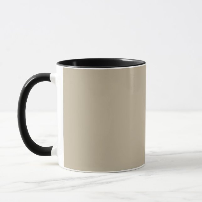 a man in a suit and tie standing in front of a wal mug (Left)