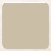 a man in a suit and tie standing in front of a wal