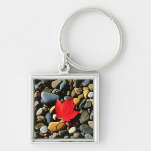 A Maple leaf on a Rock Background Key Ring
