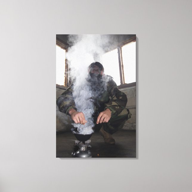 A marine fills the gas chamber with more CS gas Canvas Print (Front)