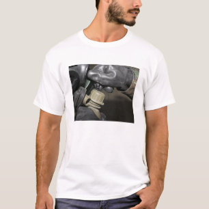 A Marine inserts a drinking tube into his cante T-Shirt