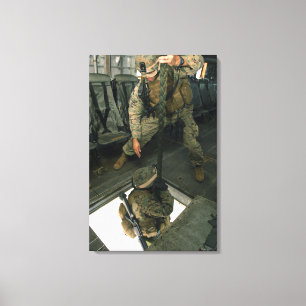 A Marine sends a fellow Marine down the hell ho Canvas Print