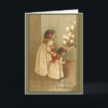 A Merry Christmas With Two Victorian Girls Holiday Card<br><div class="desc">Reminiscent of a simpler time, these pretty holiday cards have themes of Christmas, winter, children and happy times. Lovely vintage and Victorian art that you can customise by adding your own text. Create your own holiday party invitations, or simply add a joyous sentiment on the front and/or inside. Cards come...</div>