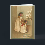 A Merry Christmas With Two Victorian Girls Holiday Card<br><div class="desc">Reminiscent of a simpler time, these pretty holiday cards have themes of Christmas, winter, children and happy times. Lovely vintage and Victorian art that you can customise by adding your own text. Create your own holiday party invitations, or simply add a joyous sentiment on the front and/or inside. Cards come...</div>
