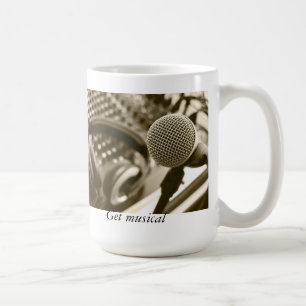 A microphone and headphones coffee mug
