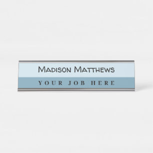 A modern navy blue handwritten script typography desk name plate