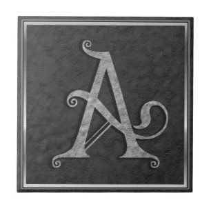 A Monogram "Mediaeval Grey Stone" Ceramic Tile
