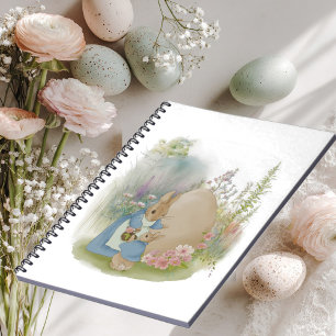 A mother rabbit with a baby rabbit in a clearing w notebook