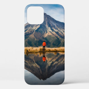 A mountaineer with an orange dress in a symmetric iPhone 12 case