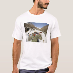 A Mujahadeen Guard walks with US Military membe T-Shirt