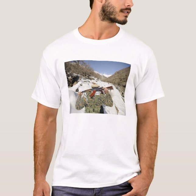 A Mujahadeen Guard walks with US Military membe T-Shirt (Front)