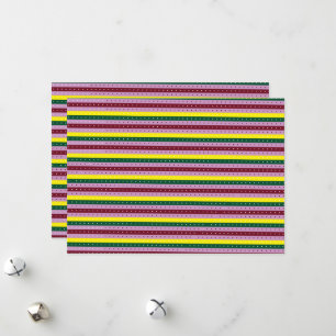 a multicolored striped background with dots holiday card