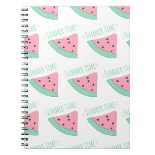 A notebook with an inscription and a watermelon