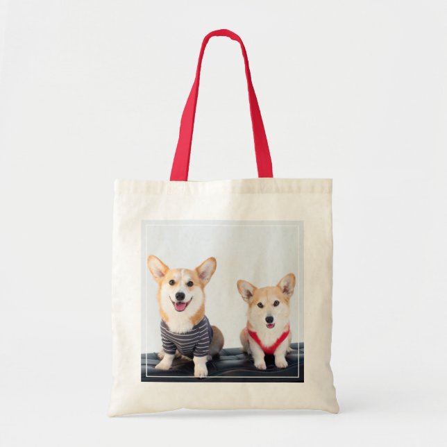 A Pair Of Corgis Sitting On A Bench Tote Bag (Front)
