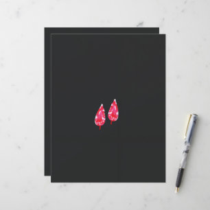 a pair of red leaves on a black background