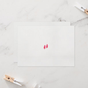 a pair of red leaves on a black background invitation
