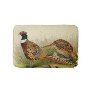 A pair of Ring necked pheasants in a grassy field Bath Mat